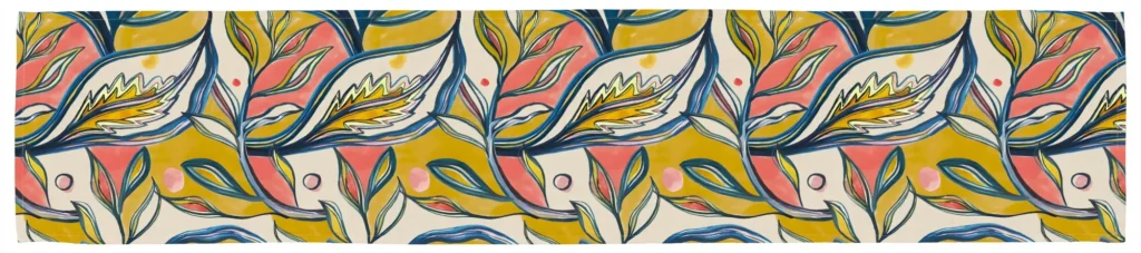 Amazon table runner laid flat showing coral and mustard leaves outlined in navy on cream