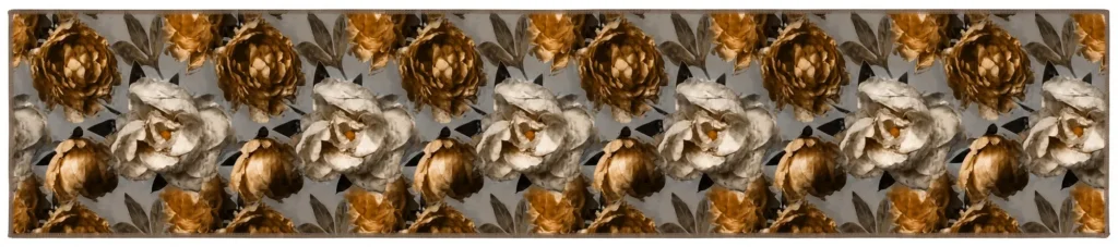 Amber Magnolia table runner laid flat showing gold and ivory blooms on a warm grey ground